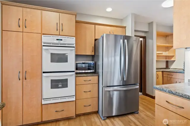 Updated efficient kitchen with granite tiled counters, under cabinet - plus above cabinet lighting.