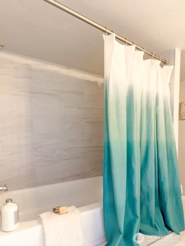 new tub and tile in downstairs bathroom