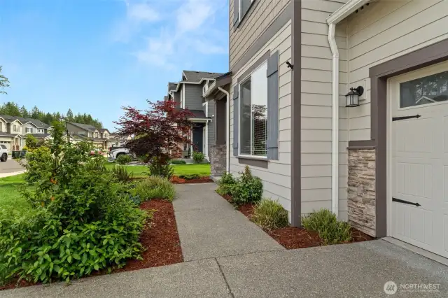 Follow the path to your next beginning—beautiful curb appeal and a charming front entry that sets the tone for the rest of the home