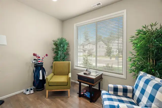 Light-filled flex space with front-facing views—perfect for a home office, reading nook, or your favorite hobby.