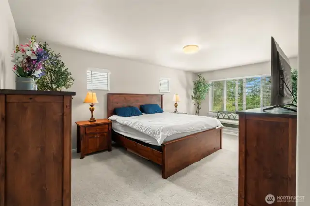 Retreat to the spacious primary suite, complete with generous natural light, serene greenbelt views, and ample room for a full bedroom set and cozy sitting area.
