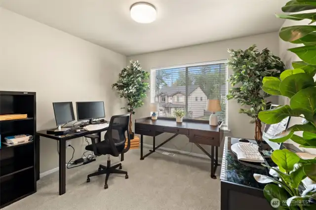 This versatile bedroom is currently being used as a home office, offering plenty of space, natural light, and flexibility to fit your needs—whether that’s working remotely or creating a cozy guest room.