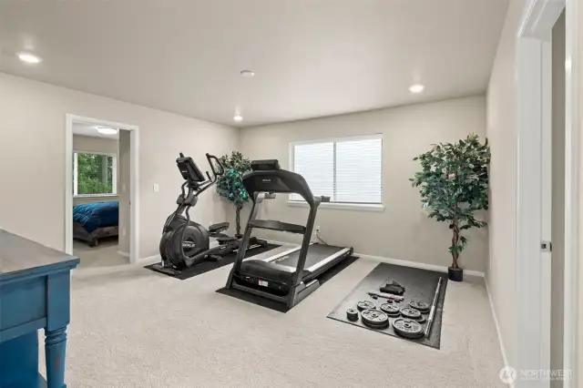 This flexible bonus room is currently set up as a home gym, but could easily transform into a playroom, media space, or second living area—tailored to fit your lifestyle.
