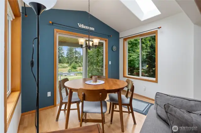 Breakfast nook with a slider to the incredible acre parcel