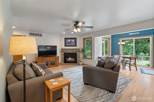 Family room right off of the kitchen, boasts a gas fireplace.