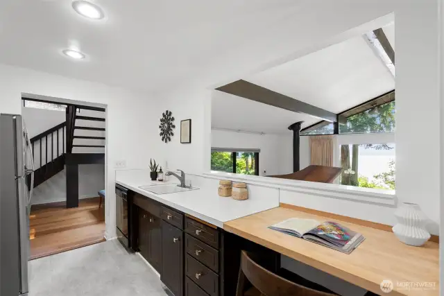 Efficient Kitchen overlooks Living Room, & Hood Canal Views