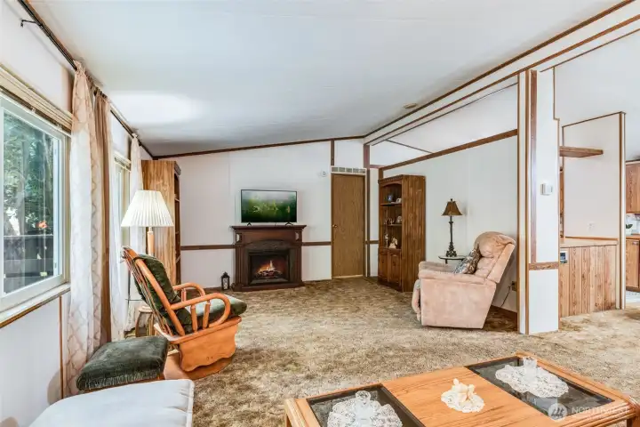 Sun-filled living room with vaulted ceilings creates a warm and welcoming space.