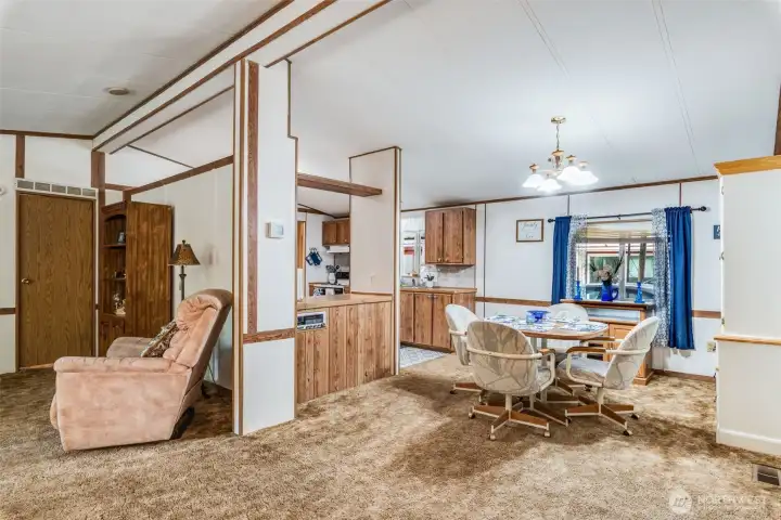 Open floor plan connects living, dining, and kitchen for seamless flow.