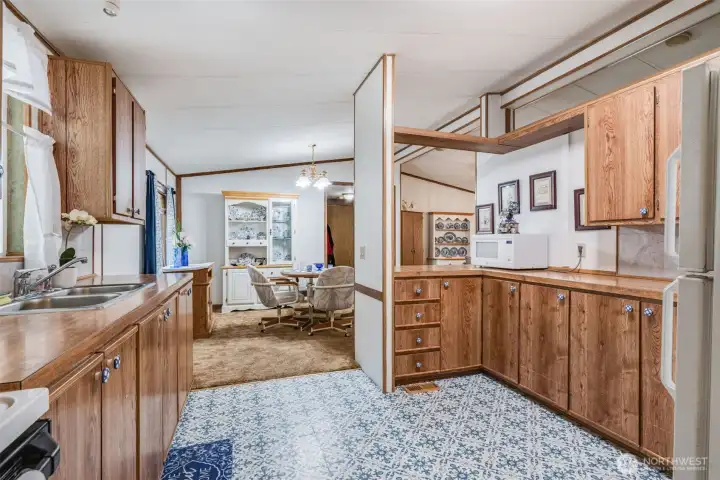 Open view from the kitchen to dining and living areas enhances flow.