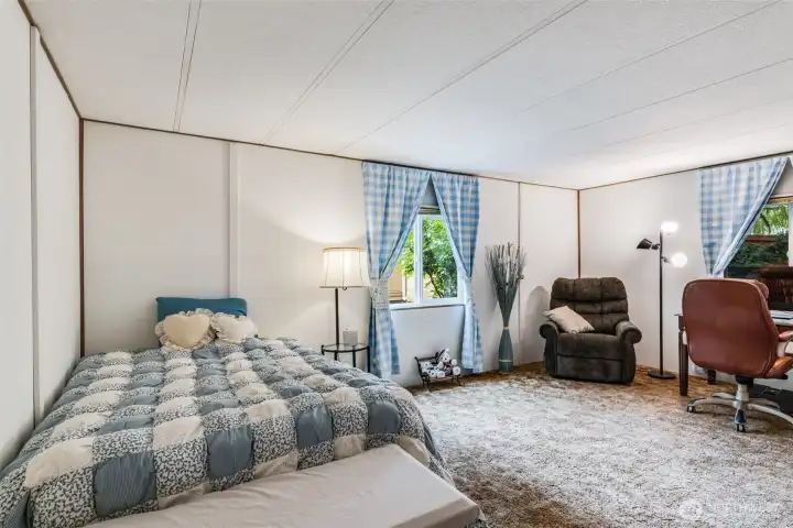 Primary suite offers plenty of room for a seating area, additional bed or home office space.