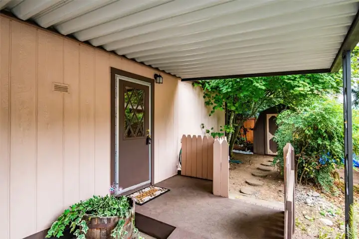 Side entry from the carport allows for sheltered access to the home.
