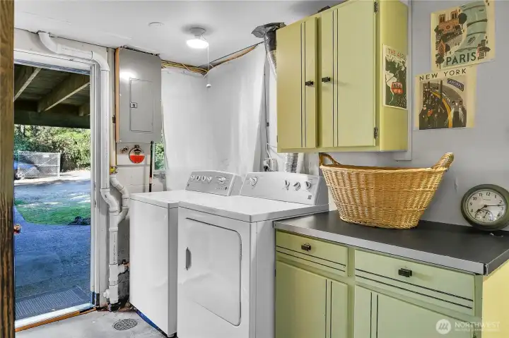 Laundry room with exit to backyard.