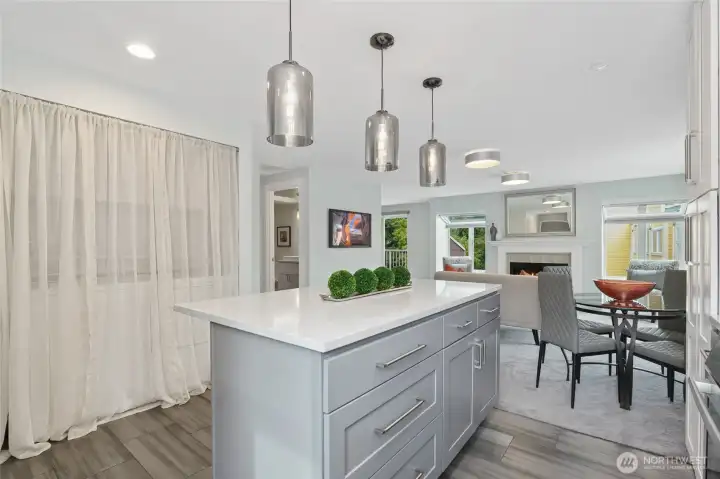 lots of easy access, drawer cabinetry under the extensive island with seating area to entertain.