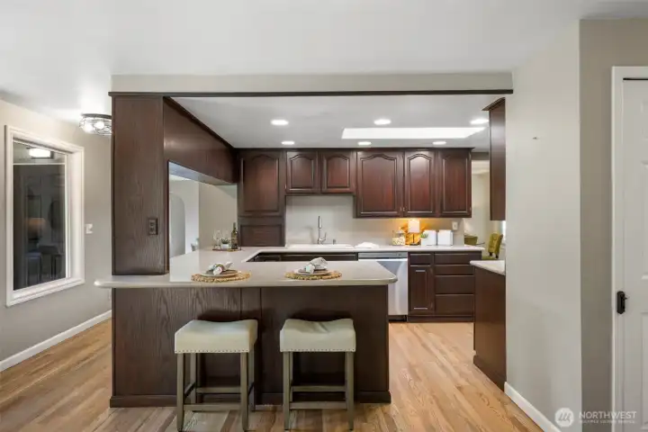 The kitchen bar and island open up into the eating area/great room