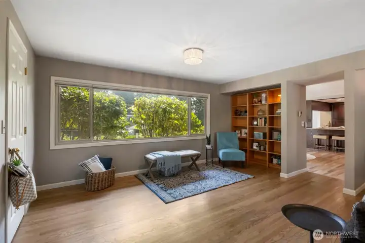 Bonus room has large windows to bring in light. The bookcases convey with the property. Its a great place to sit back and relax!