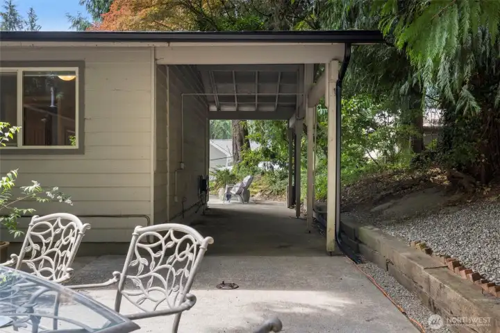 The covered patio area is a great space for storing yard tools or maybe even an entertainment space!