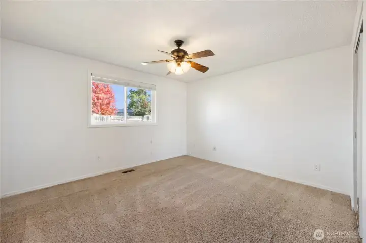 Primary bedroom with ceiling fan