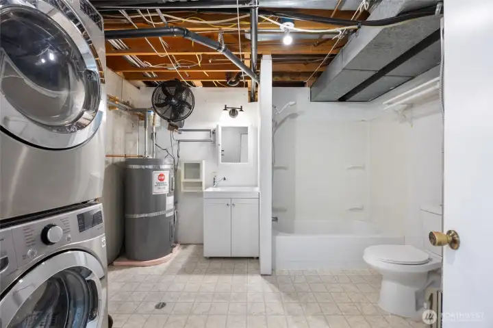 Laundry with washer and dryer & full bath in basement