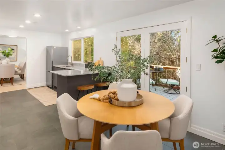 Eat-in kitchen with access to the deck, overlooking the backyard.