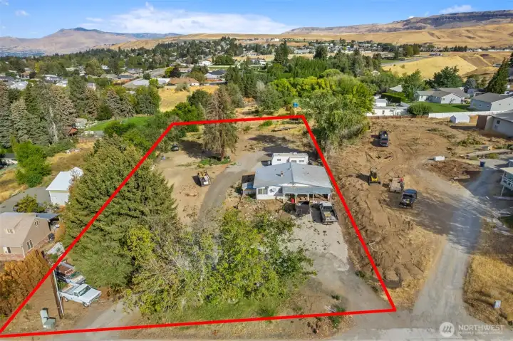 Aerial view showcasing the full footprint of this rare double parcel opportunity on desirable Grant Road with exceptional future potential.