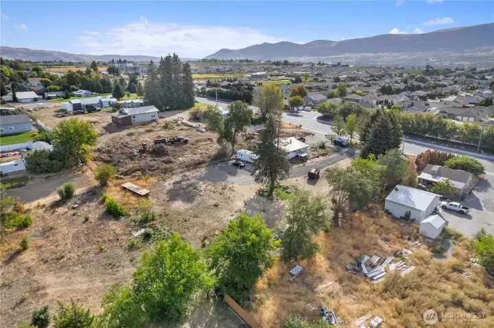 Drone image highlighting easy access to nearby schools, shopping, restaurants, and everyday amenities.