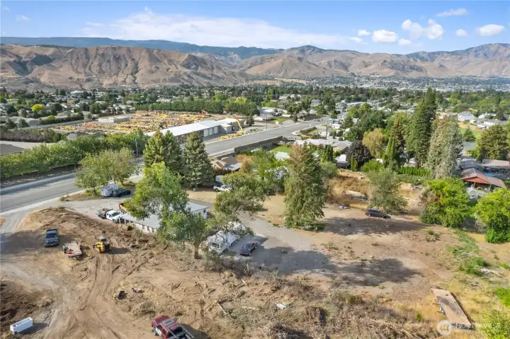 Drone image highlighting easy access to nearby schools, shopping, restaurants, and everyday amenities.