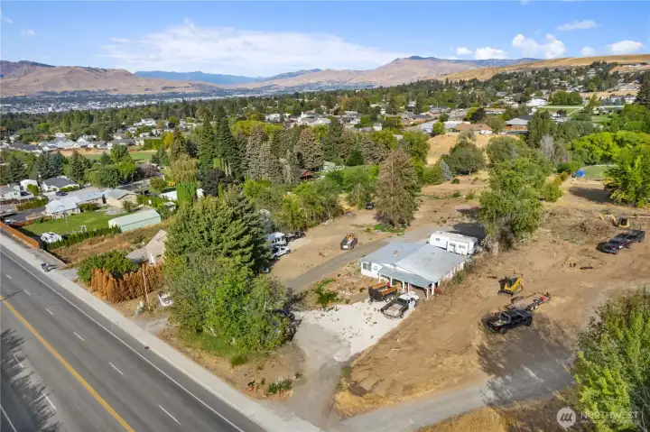 Drone image highlighting easy access to nearby schools, shopping, restaurants, and everyday amenities.