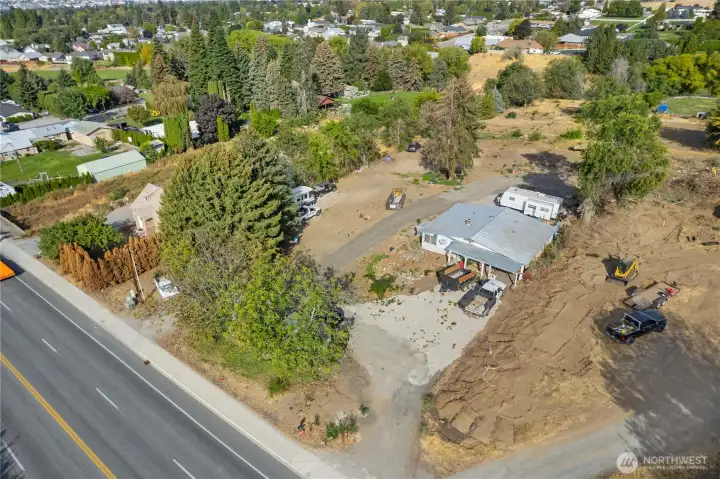 Drone image highlighting easy access to nearby schools, shopping, restaurants, and everyday amenities.