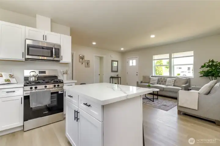 Kitchen island has room for a couple of bar stools