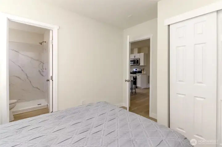 Primary bedroom has it's own bathroom with walk in shower