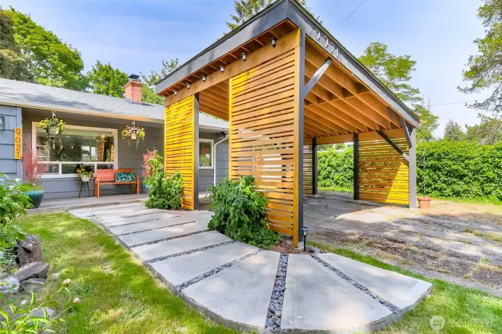 Experience the stunning features of this exceptional Dolly Madison Street home, which includes convenient covered RV parking integrated under the left side of the carport.