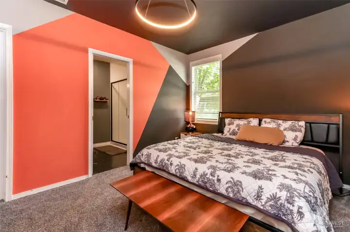 Spacious primary suite featuring a newly renovated en suite bathroom. This home showcases a unique, artistic flair throughout.