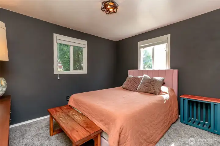 Bedroom 2: Alternate angle showing two large windows that provide a natural light.