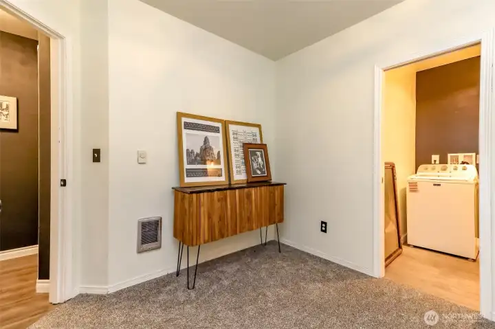This is the fourth bedroom, which also functions as a family room or media room and features direct access to the laundry room.
