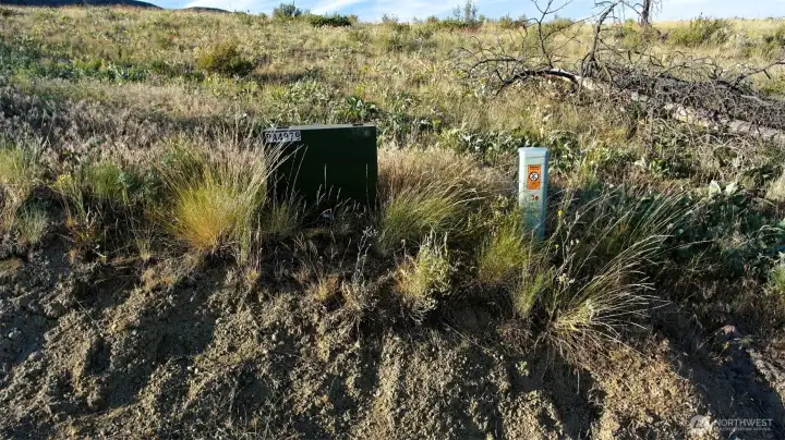 Electricity/ Phone in road.