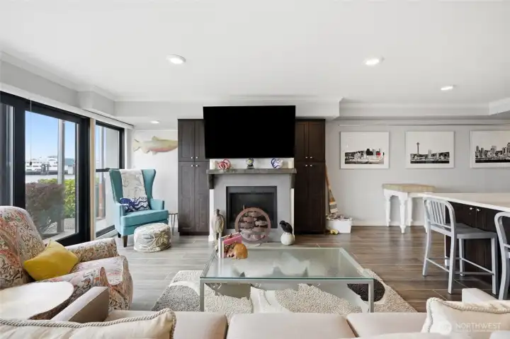 Custom concrete mantel, gas fireplace, and built-in cabinetry. Custom concrete mantel, gas fireplace, and built-in cabinetry.
