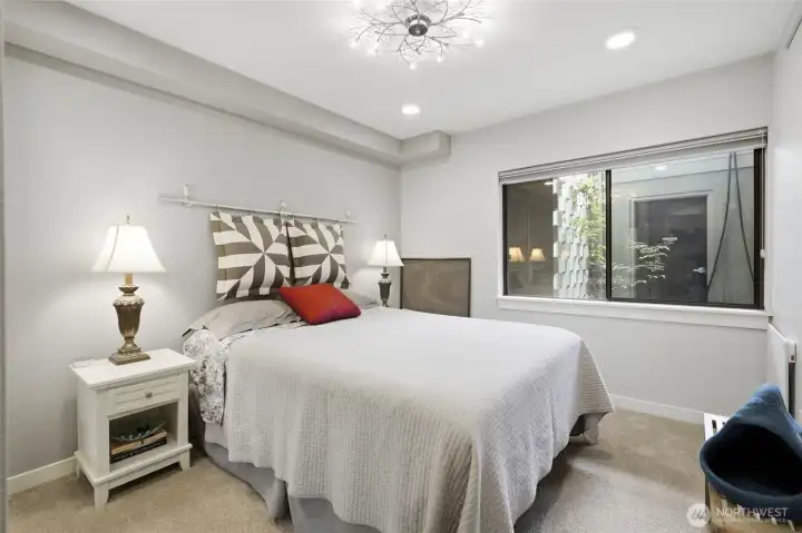 Spacious guest room with ample closet space. Spacious guest room with ample closet space.