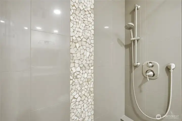 Custom tiled shower in the guest bath. Custom tiled shower in the guest bath.