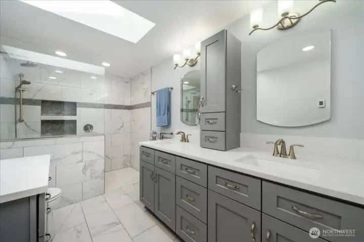 Tile floors, good storge space, his and her sinks