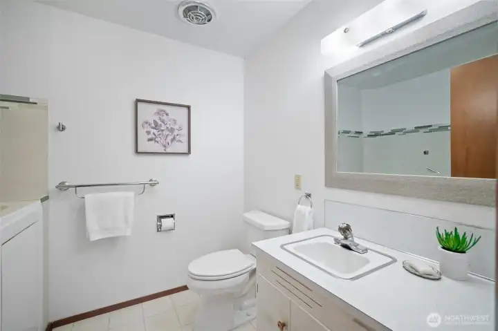 The second 3/4 bathroom features a walk in bath tub.