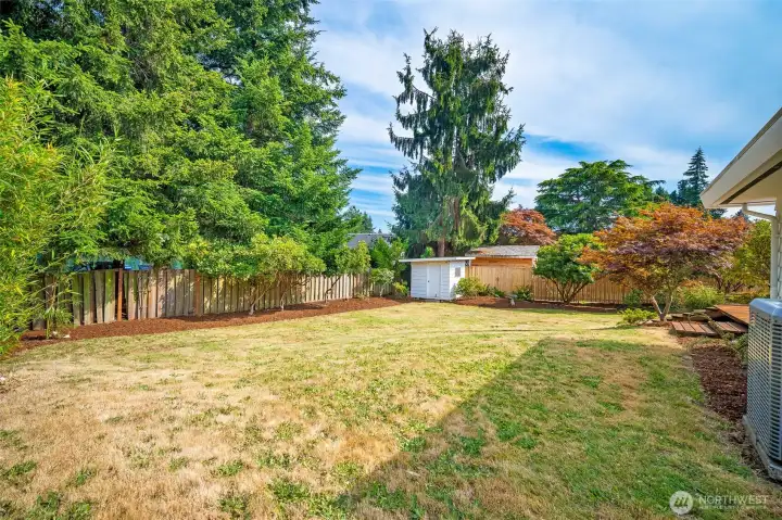The mature trees provide privacy and character.