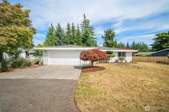 The attached 2 car garage and driveway space.