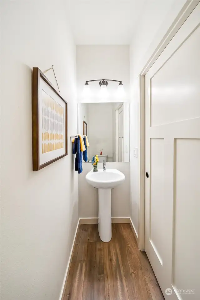 Half bath discretely placed near the laundry room offers main floor ease for guests.