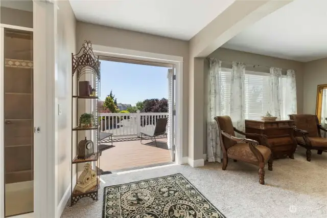 French doors open to private deck off primary bedroom.