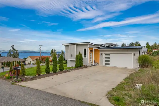 Welcome to 8728 Charel Drive, special property with 2437 sq. ft. with primary and living areas all on the main level. Spectacular view of the water, the city lights of White Rock Canada and the Canadian Mountain range.