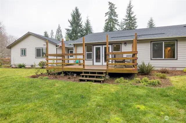 Large deck off the back door that leads to the fully fenced back yard area. This is from the living room