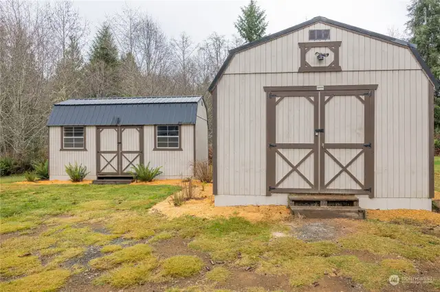 Large 14x30 out building on the right is set up currently as a wood working shop. The outbuilding on the left is 10x20 and currently set up as an exercise/gym room. Both have power and lights