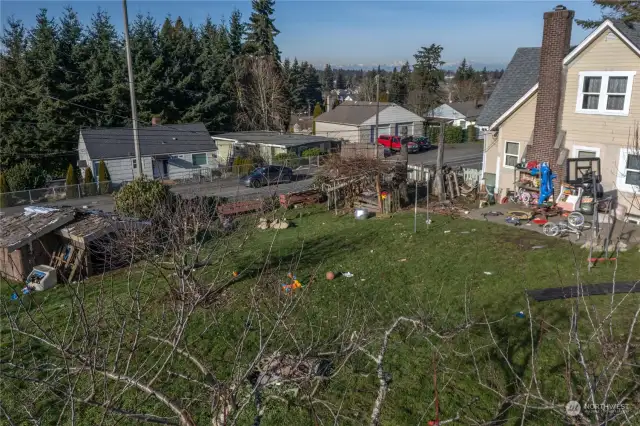 Oversized corner lot featuring fruit trees and subdivision potential. Buyer to verify feasibility.