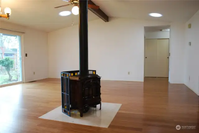 From dining area looking across bamboo floored great room towards the back slider and the hallway to the bedroom area.