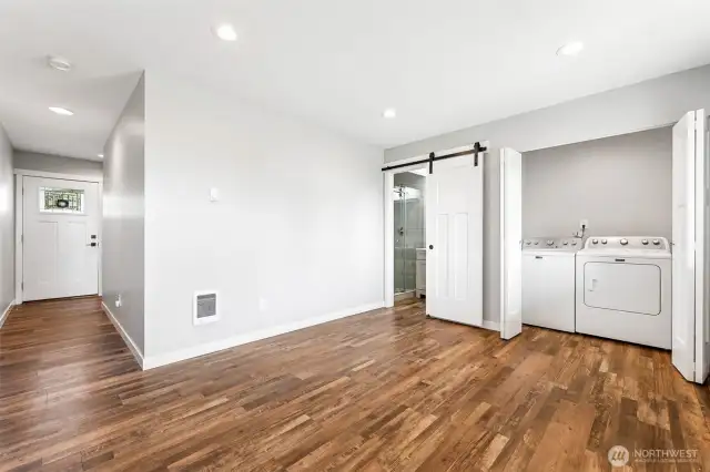 Utility room and 3/4 bath also on entry level.